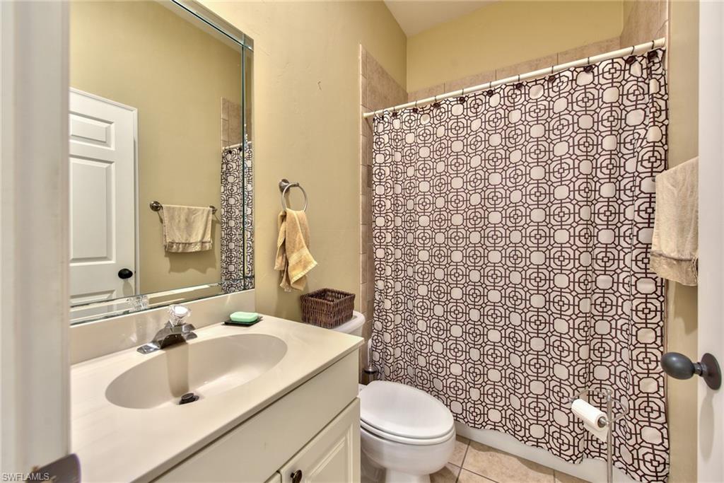 3748 Kent Drive Naples, FL 34112 - Photo 2 of 30 a bathroom with a sink toilet and shower