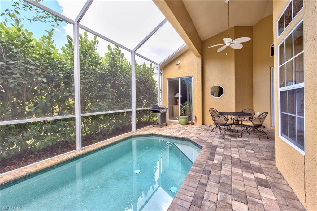 3748 Kent Drive Naples, FL 34112 - Photo 25 of 30 a view of swimming pool with outdoor seating