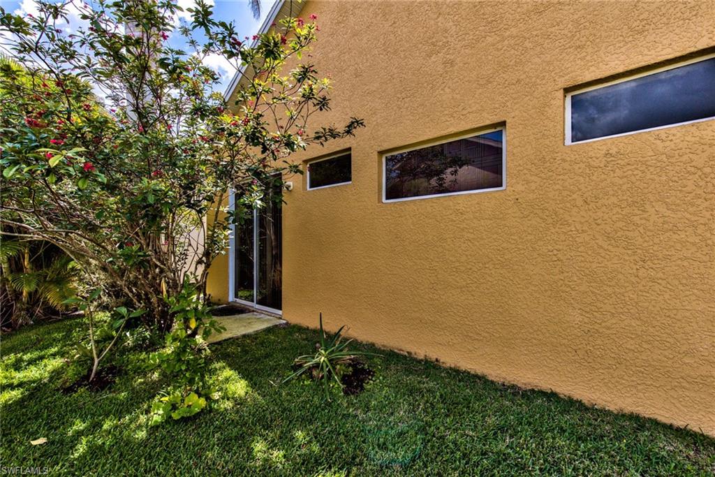 3748 Kent Drive Naples, FL 34112 - Photo 27 of 30 a house with garden in front of it