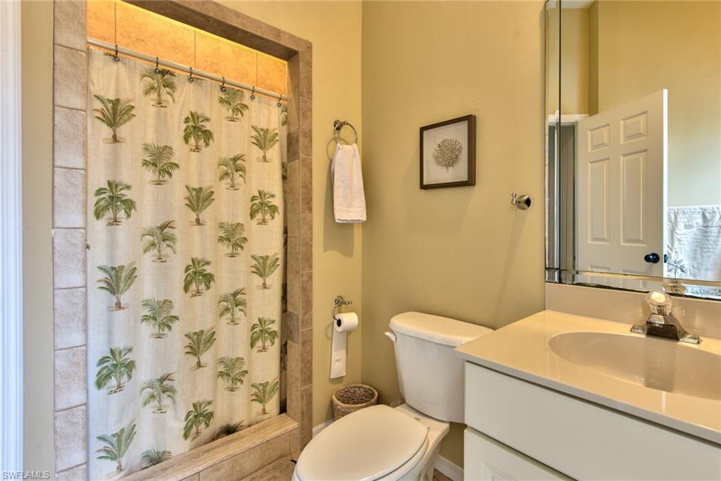 3748 Kent Drive Naples, FL 34112 - Photo 28 of 30 a bathroom with a sink toilet and shower
