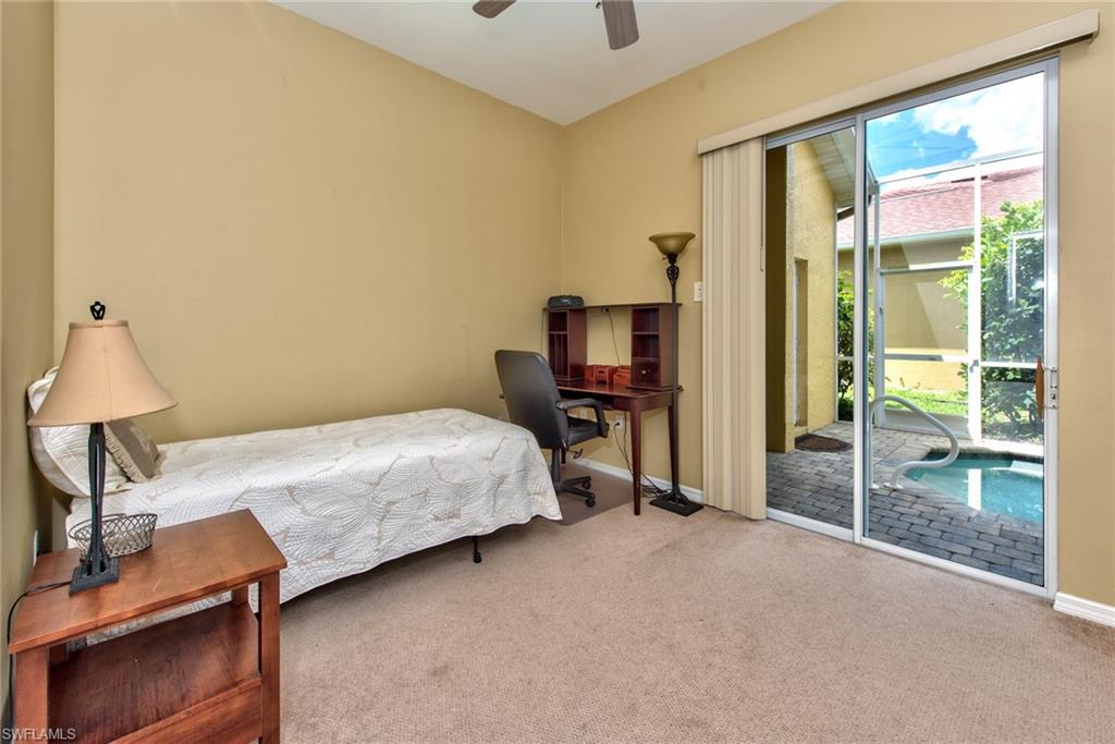 3748 Kent Drive Naples, FL 34112 - Photo 3 of 30 a bedroom with a bed and large window