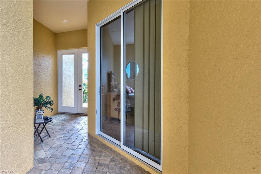 3748 Kent Drive Naples, FL 34112 - Photo 5 of 30 a view of a hallway with furniture and front door