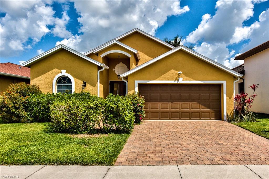 3748 Kent Drive Naples, FL 34112 - Photo 9 of 30 a front view of a house with garden