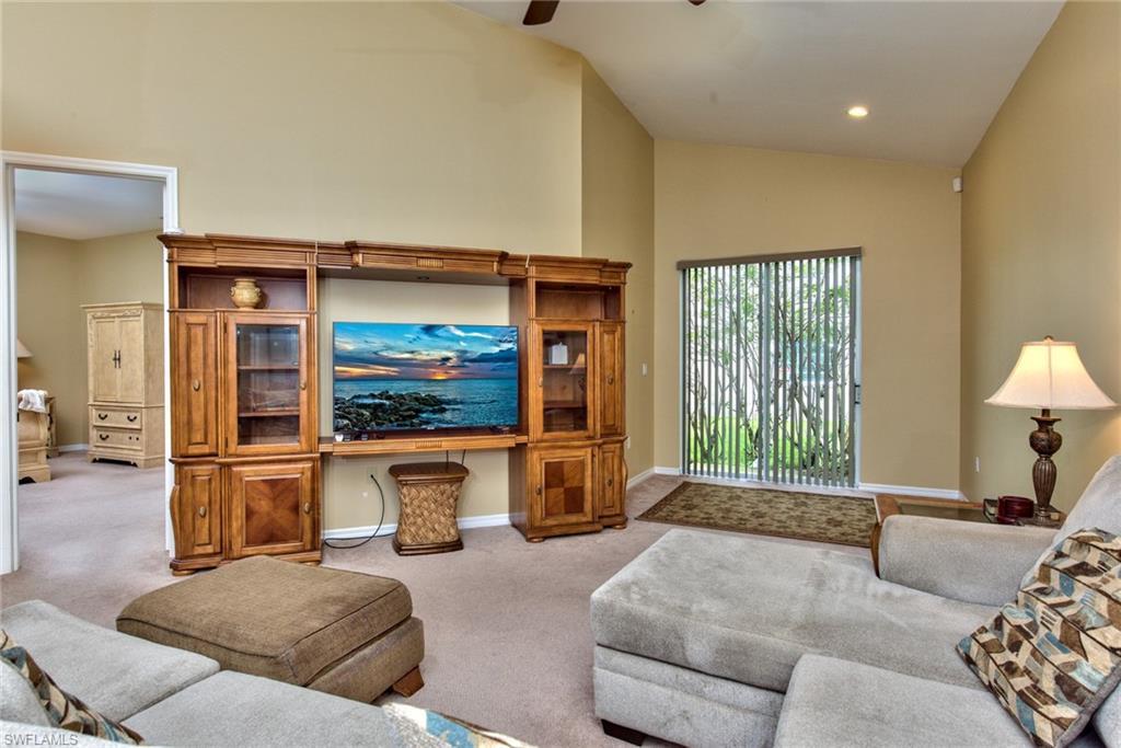 3748 Kent Drive Naples, FL 34112 - Photo 10 of 30 a living room with furniture and a flat screen tv