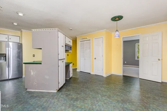 a view of a storage & utility room with a window