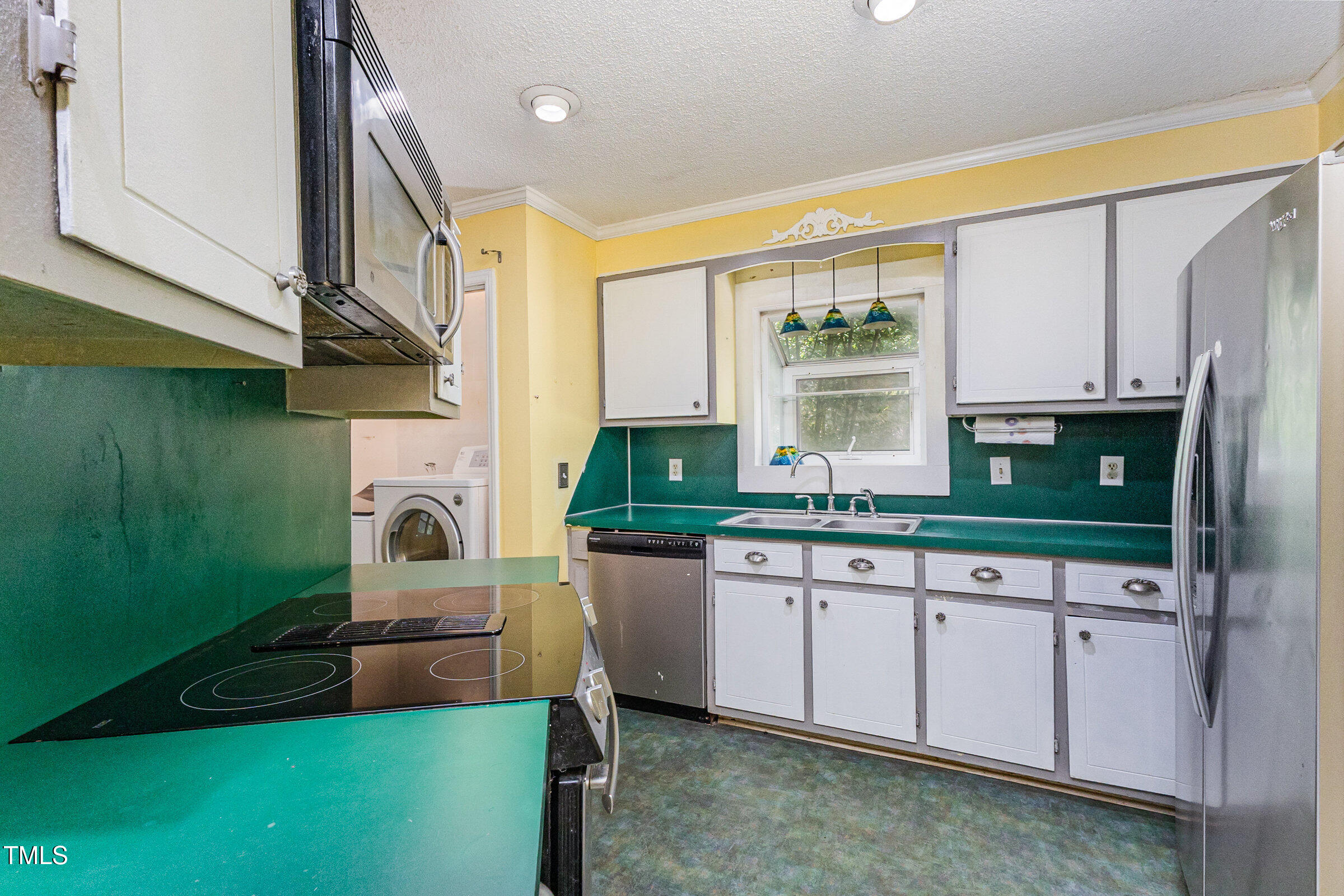 817 Bent Creek Road Bahama, NC 27503 - Photo 13 of 45 a kitchen with a sink cabinets and window