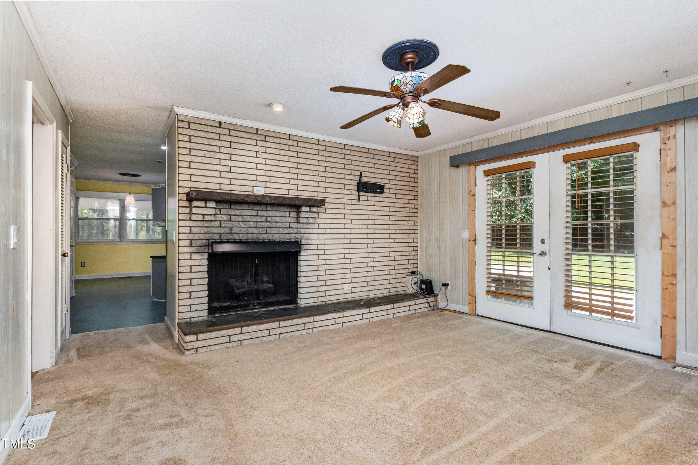 817 Bent Creek Road Bahama, NC 27503 - Photo 14 of 45 a view of a livingroom with a fireplace and window