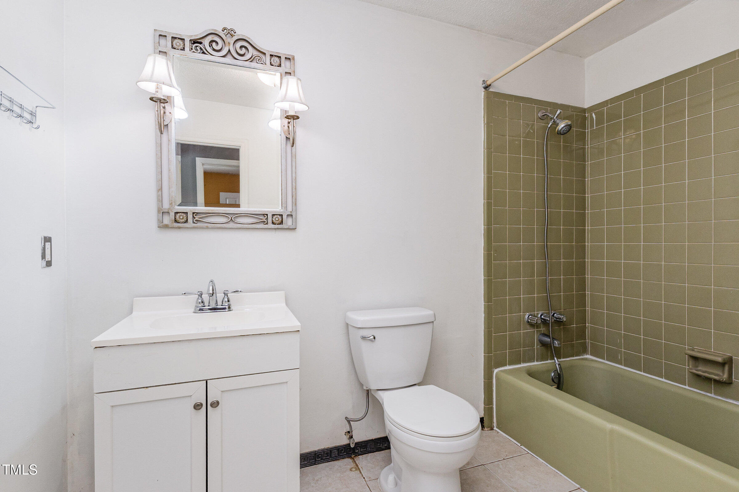 817 Bent Creek Road Bahama, NC 27503 - Photo 19 of 45 a bathroom with a toilet sink and mirror