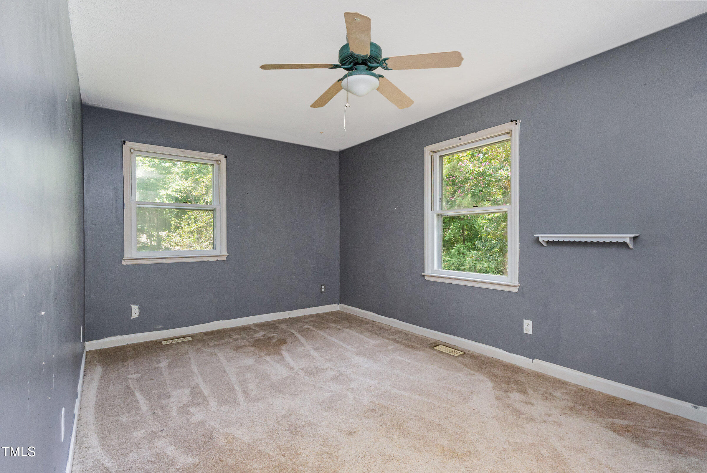 817 Bent Creek Road Bahama, NC 27503 - Photo 20 of 45 an empty room with windows and fan
