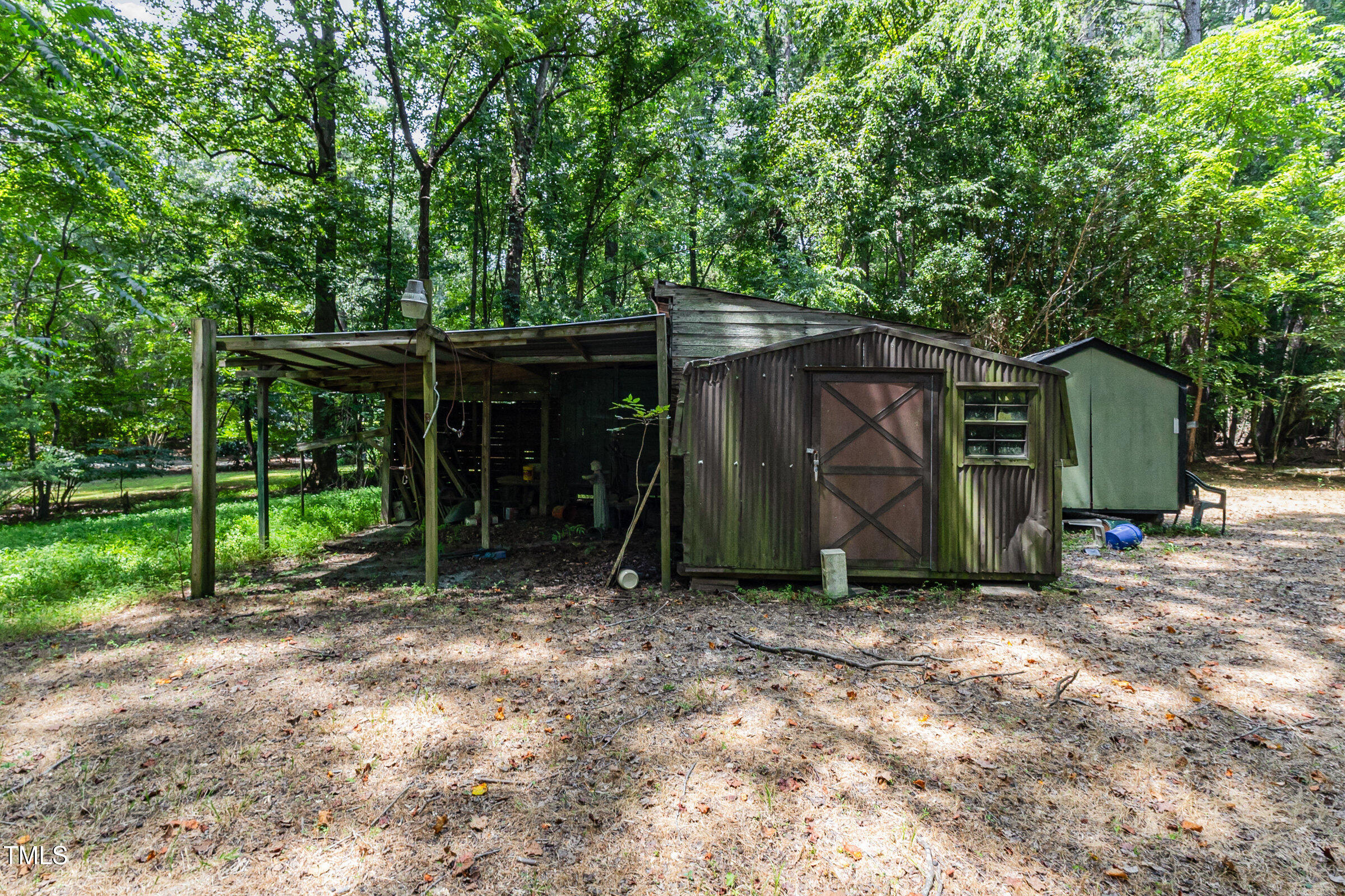 817 Bent Creek Road Bahama, NC 27503 - Photo 32 of 45 a view of a barn in the middle of a yard