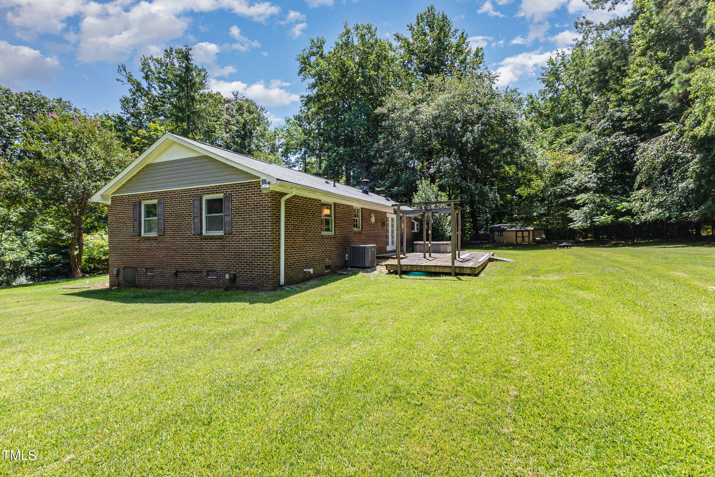 817 Bent Creek Road Bahama, NC 27503 - Photo 33 of 45 a front view of a house with a garden and trees