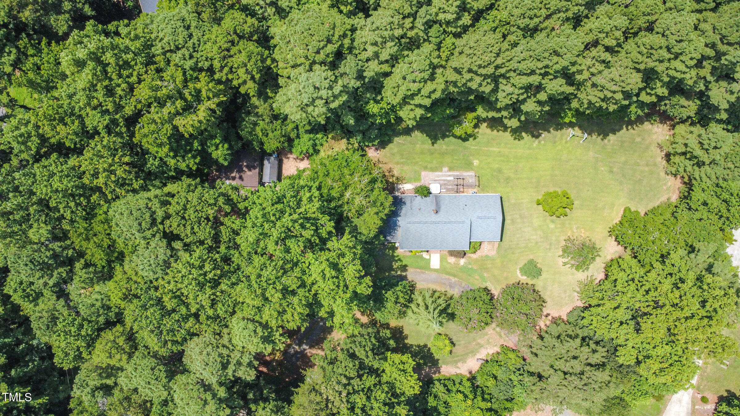 817 Bent Creek Road Bahama, NC 27503 - Photo 37 of 45 an aerial view of a house with a yard and large tree