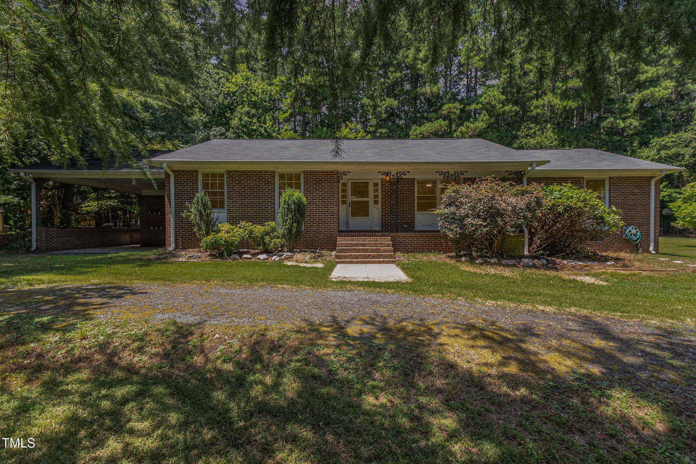 817 Bent Creek Road Bahama, NC 27503 - Photo 43 of 45 a backyard of a house with yard and outdoor seating