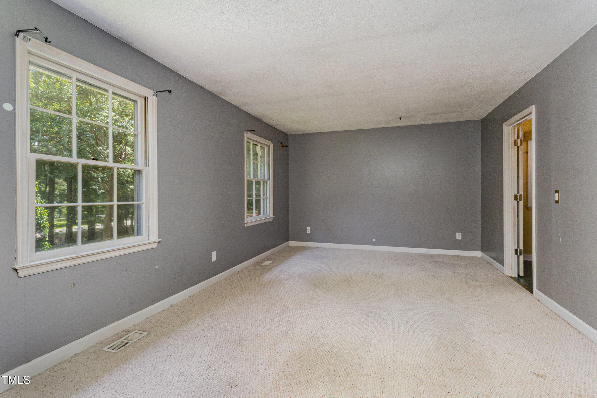 817 Bent Creek Road Bahama, NC 27503 - Photo 7 of 45 an empty room with windows