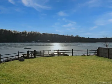 a view of a lake with sitting area