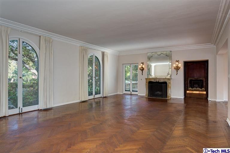 1255 Wentworth Avenue Pasadena, CA 91106 - Photo 13 of 44 an empty room with windows fireplace and wooden floor
