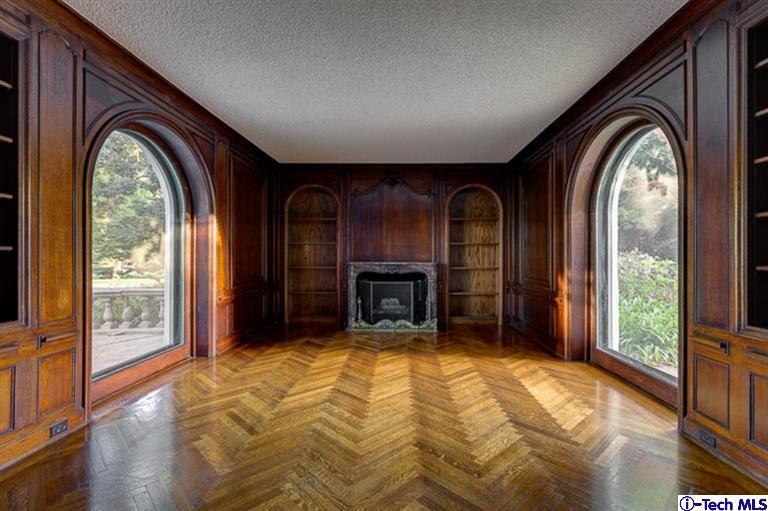 1255 Wentworth Avenue Pasadena, CA 91106 - Photo 17 of 44 a view of a livingroom with a fireplace wooden floor and windows