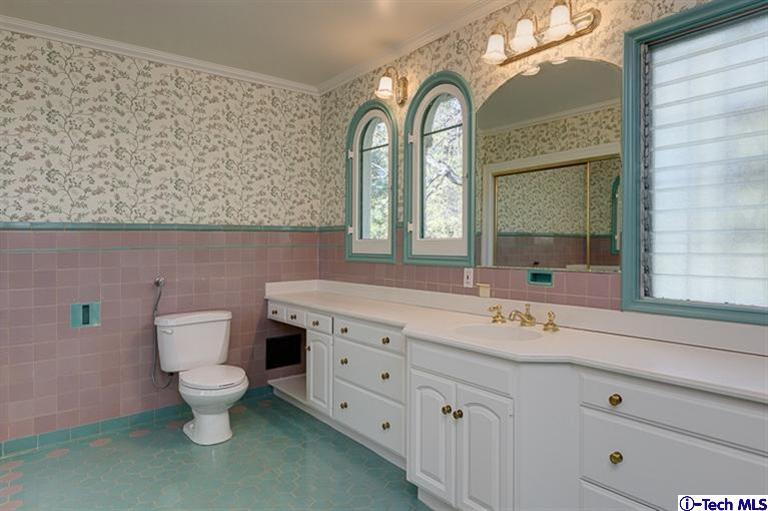 1255 Wentworth Avenue Pasadena, CA 91106 - Photo 28 of 44 a bathroom with a toilet sink and mirror