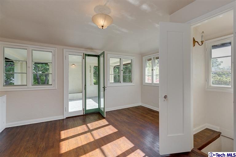 1255 Wentworth Avenue Pasadena, CA 91106 - Photo 29 of 44 a view of an empty room with window and wooden floor