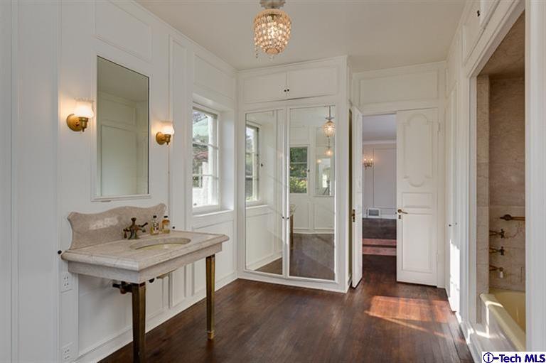 1255 Wentworth Avenue Pasadena, CA 91106 - Photo 31 of 44 a bathroom with a sink and a mirror