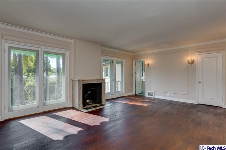 1255 Wentworth Avenue Pasadena, CA 91106 - Photo 34 of 44 a view of a livingroom with wooden floor and a fireplace