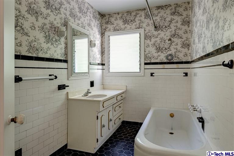 1255 Wentworth Avenue Pasadena, CA 91106 - Photo 39 of 44 a bathroom with a sink and a bathtub