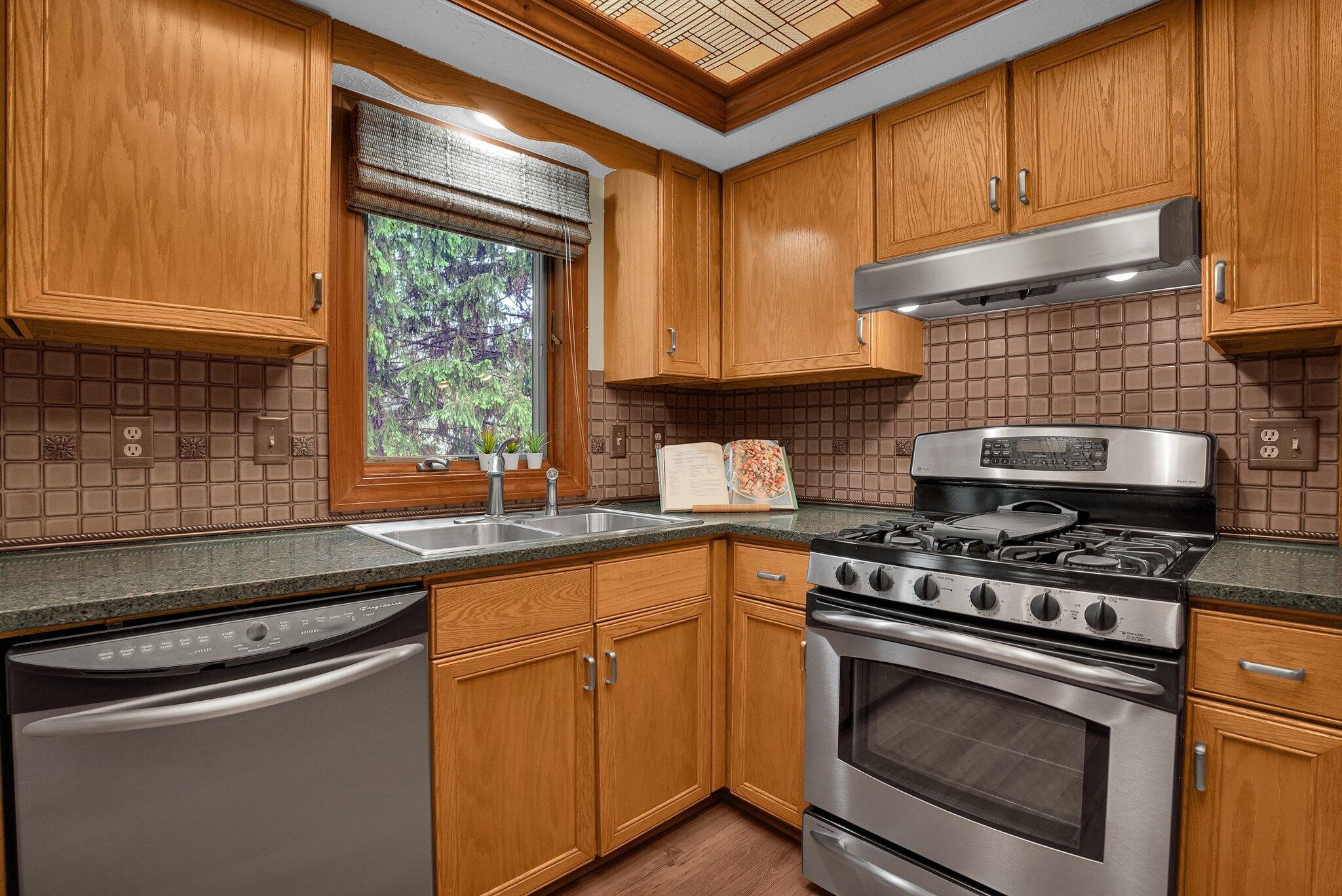623 Rockbridge Road Westerville, OH 43081 - Photo 15 of 63 Well-appointed kitchen has stainless steel appliances, granite countertops and custom backsplash. Large double door pantry makes storing your snacks easy!