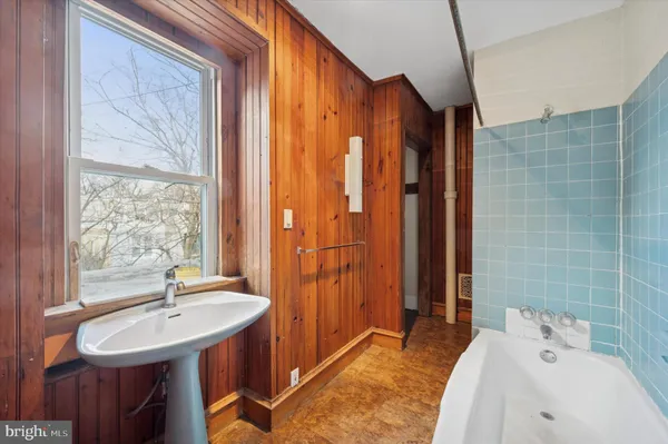 a bathroom with a sink and a tub