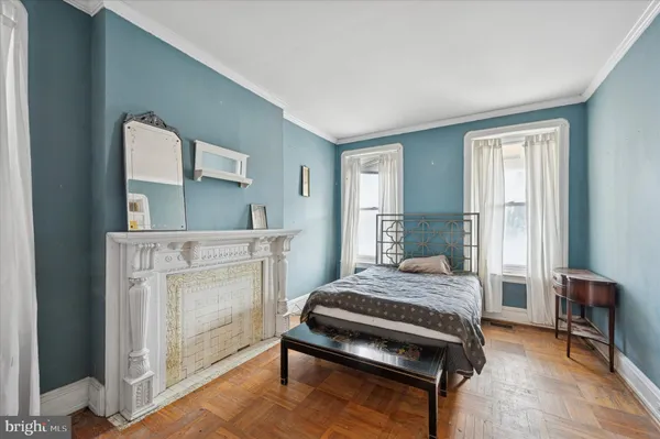 a bedroom with a bed and a view of bathroom