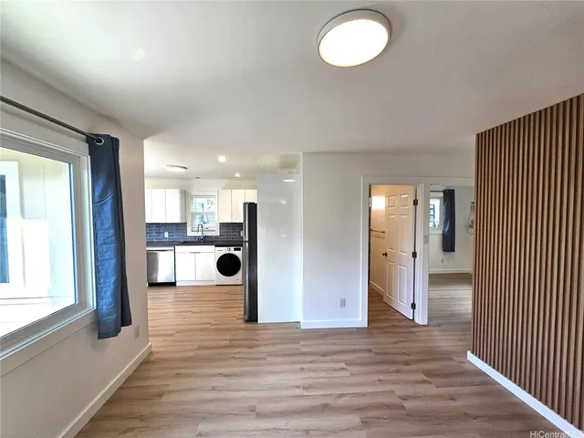 a view of a livingroom with wooden floor