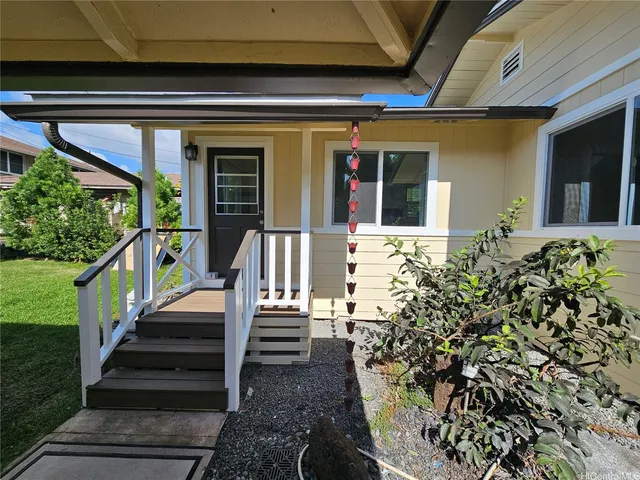 a view of a house with a flower garden