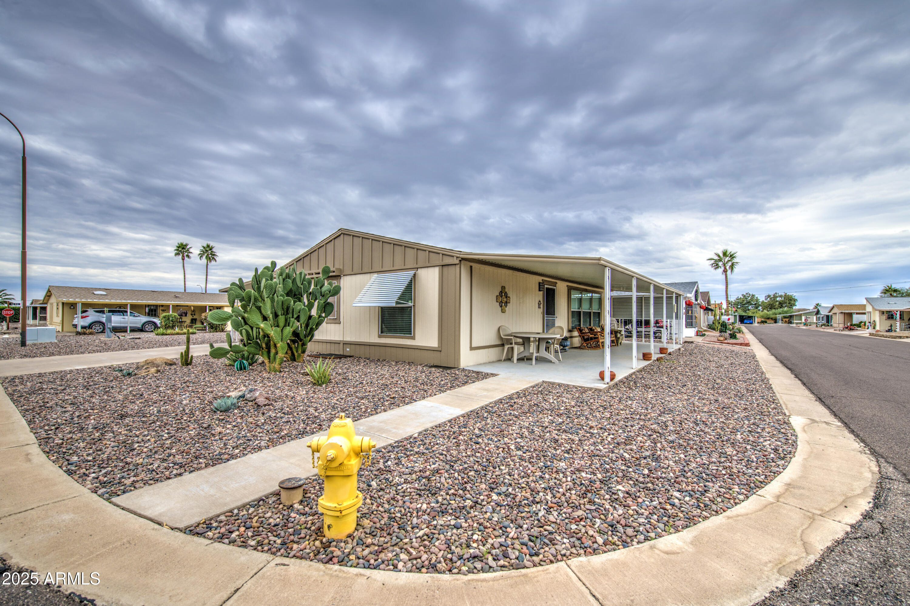 2208 West Baseline Avenue, Unit 67 Apache Junction, AZ 85120 - Photo 12 of 41 a view of a house with entertaining space