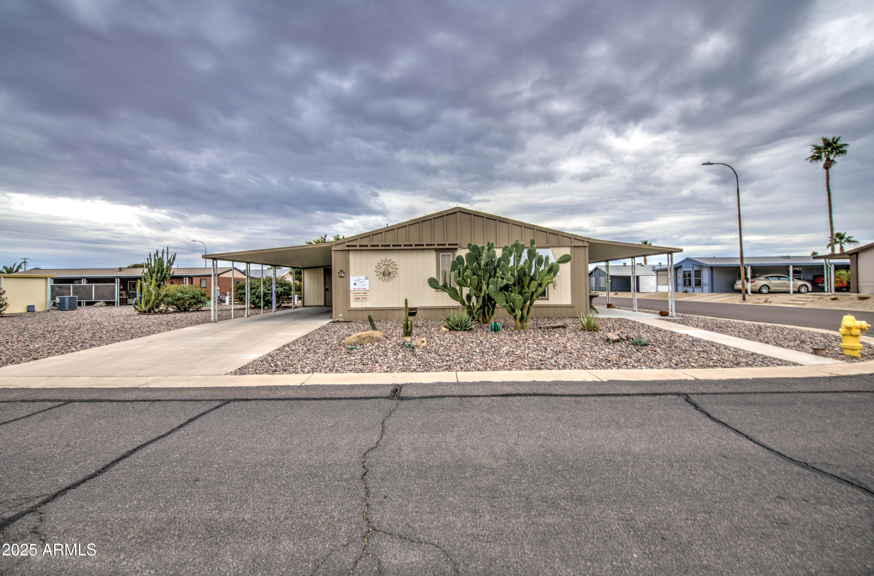 2208 West Baseline Avenue, Unit 67 Apache Junction, AZ 85120 - Photo 14 of 41 a view of building with car parked