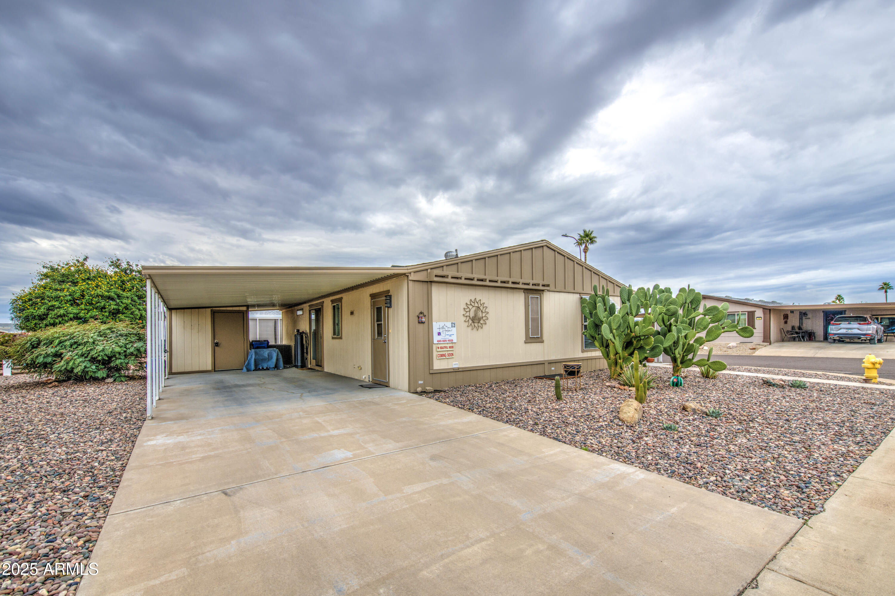 2208 West Baseline Avenue, Unit 67 Apache Junction, AZ 85120 - Photo 16 of 41 a view of a house with a patio