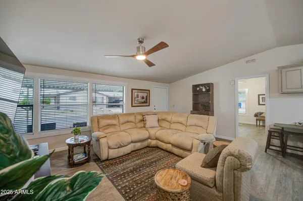 a living room with furniture and a large window
