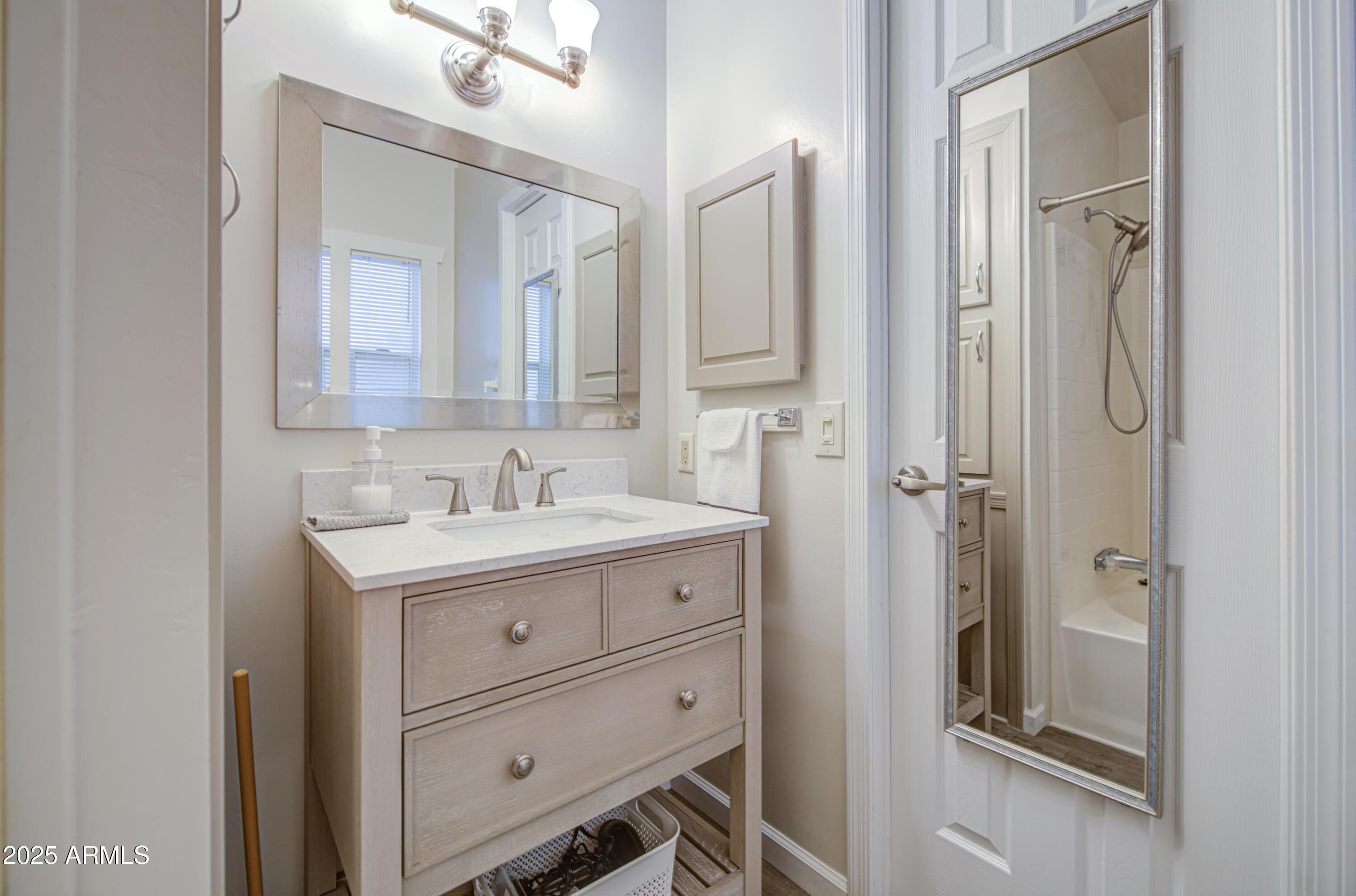 2208 West Baseline Avenue, Unit 67 Apache Junction, AZ 85120 - Photo 33 of 41 a bathroom with a granite countertop sink mirror and a toilet