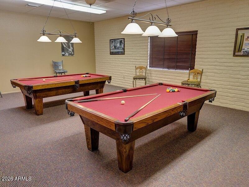 2208 West Baseline Avenue, Unit 67 Apache Junction, AZ 85120 - Photo 39 of 41 a room with pool table and windows
