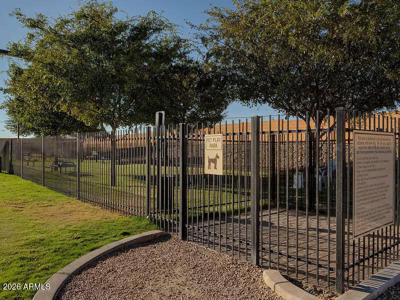 2208 West Baseline Avenue, Unit 67 Apache Junction, AZ 85120 - Photo 40 of 41 a view of a wrought iron fences in front of house