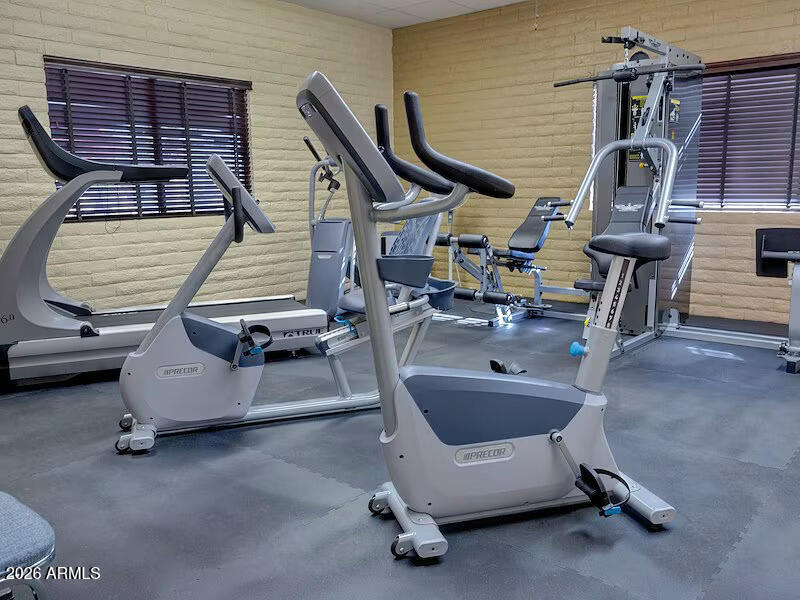 2208 West Baseline Avenue, Unit 67 Apache Junction, AZ 85120 - Photo 41 of 41 a view of a patio with a table and chairs