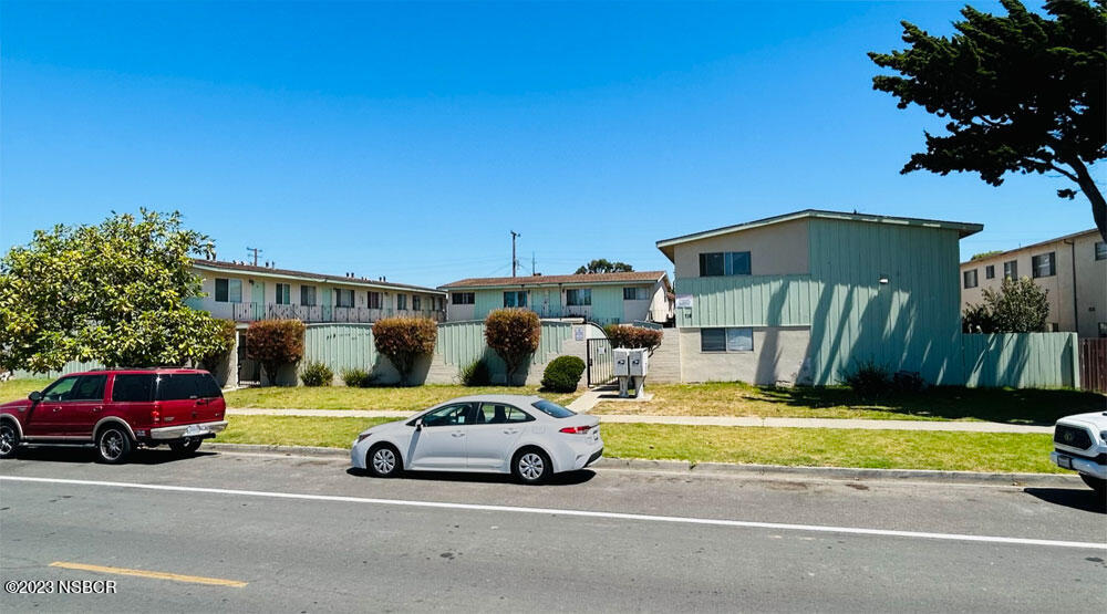 716 North G Street Lompoc, CA 93436 - Photo 3 of 5 a view of a cars parked in front of a house