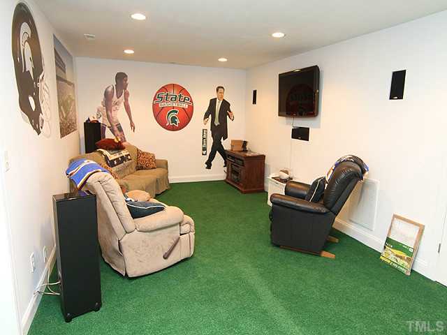 511 Mason Road Durham, NC 27712 - Photo 15 of 25 a living room with furniture and a flat screen tv