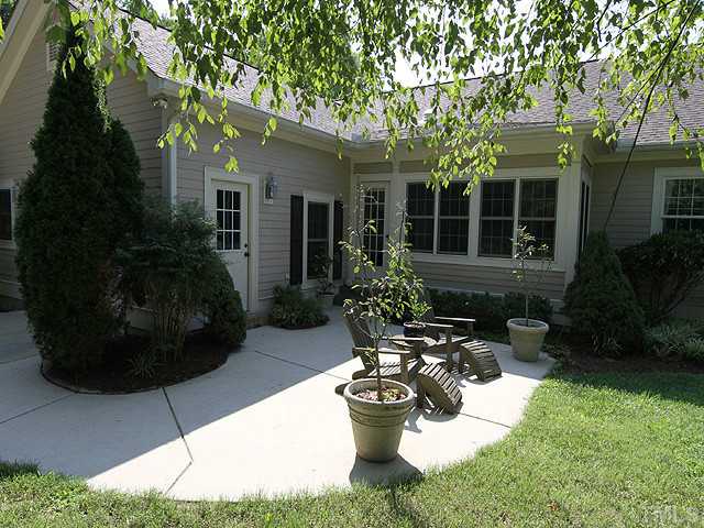 511 Mason Road Durham, NC 27712 - Photo 19 of 25 a view of a house with backyard sitting area and garden