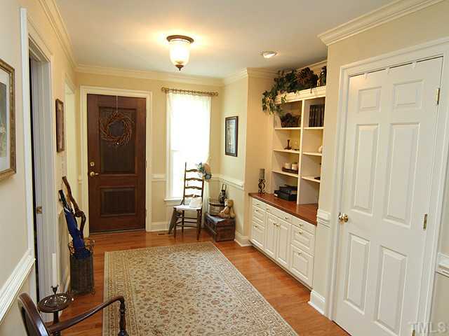 511 Mason Road Durham, NC 27712 - Photo 2 of 25 a view of a hallway with wooden floor and windows