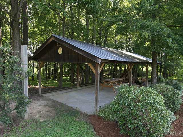 511 Mason Road Durham, NC 27712 - Photo 22 of 25 a view of a chair and table in the garden