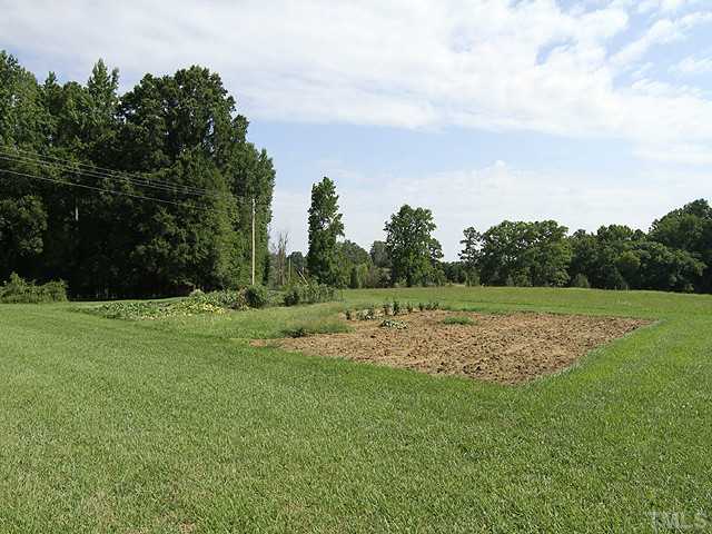 511 Mason Road Durham, NC 27712 - Photo 24 of 25 a view of outdoor space with green field and trees all around