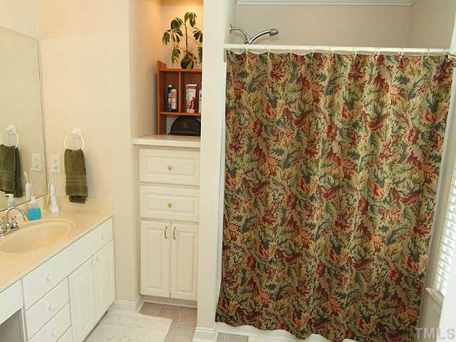 511 Mason Road Durham, NC 27712 - Photo 10 of 25 a bathroom with a sink and a mirror