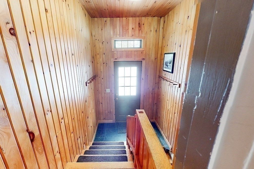 63 Conant Street Acton, MA 01720 - Photo 15 of 30 a view of a hallway with wooden floor and staircase