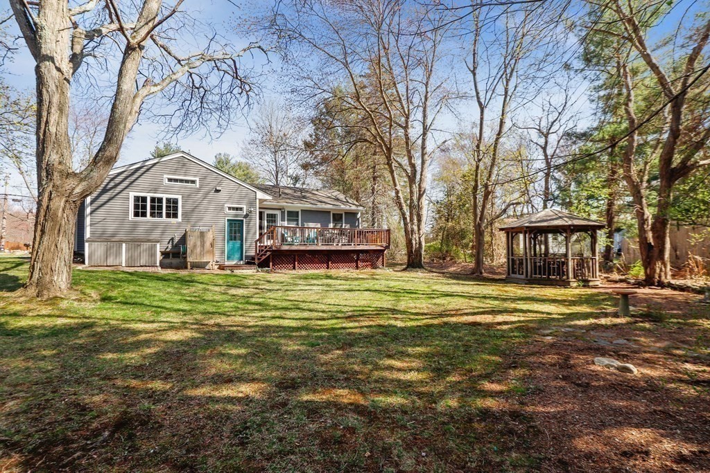 63 Conant Street Acton, MA 01720 - Photo 24 of 30 a front view of a house with a garden