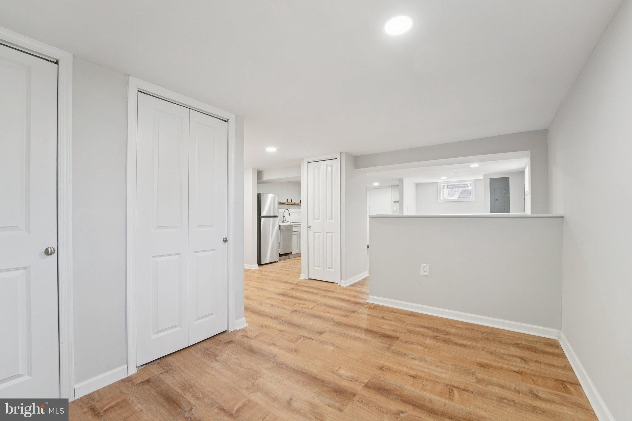 5701 The Alameda Baltimore, MD 21239 - Photo 26 of 29 a view of an empty room with wooden floor and a window