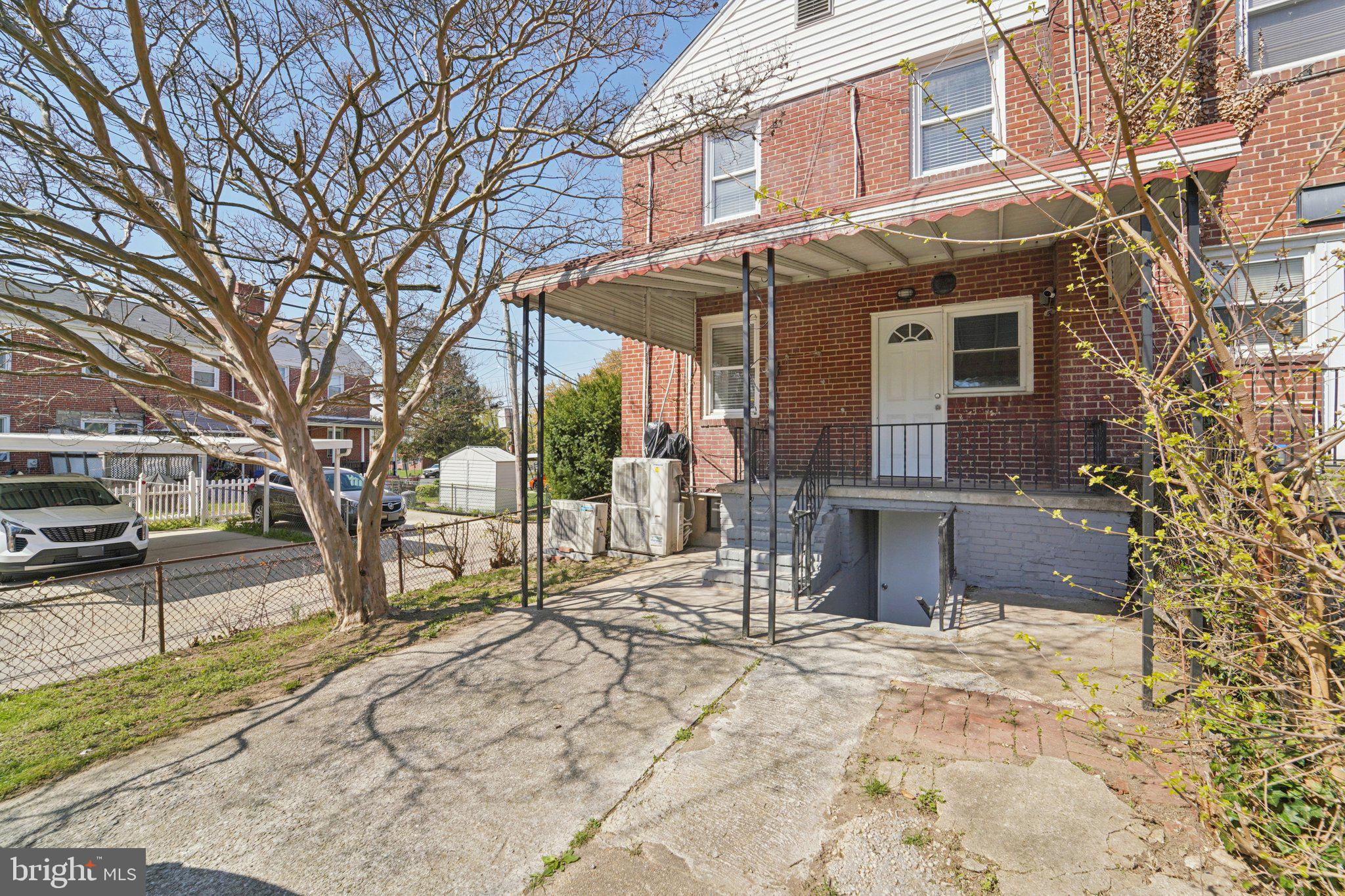 5701 The Alameda Baltimore, MD 21239 - Photo 28 of 29 a view of a house with a yard covered in snow